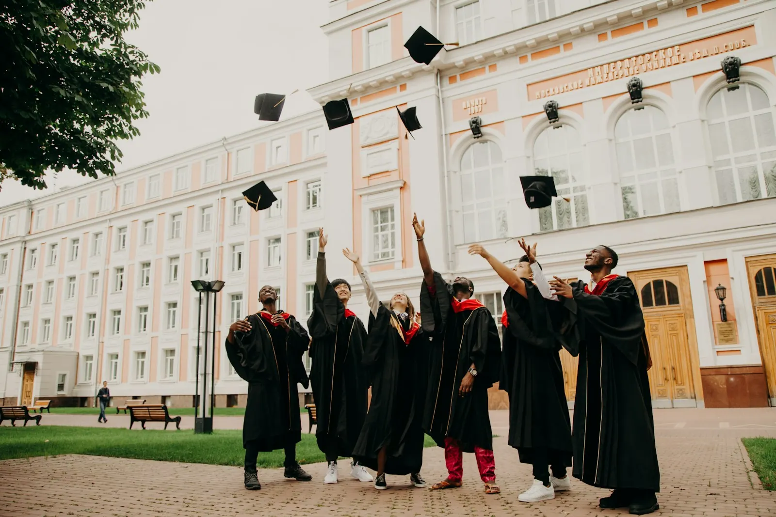 Graduates throwing their caps in the air in celebration